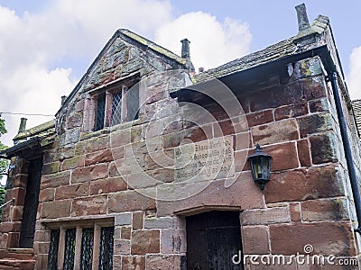 Elizabethan Schoolhouse by St Maryâ€™s Parish Church in Nether Alderley Cheshire. Editorial Stock Photo